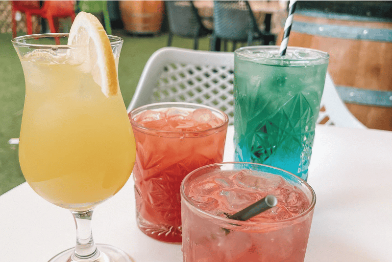 Delicious range of colourful cocktails shown in different shaped glasses